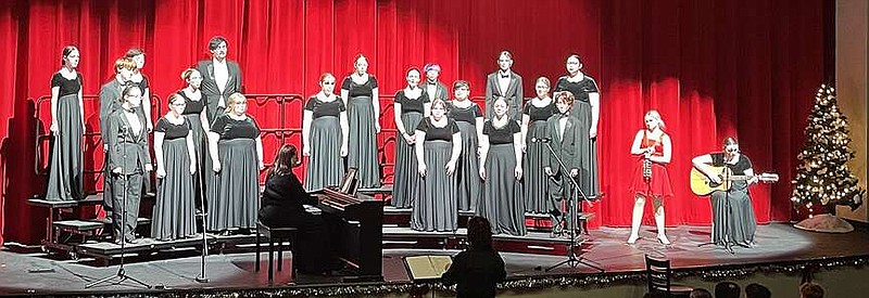 Courtesy photograph
The Pea Ridge High School Concert choir performed “Mistletoe” with instrumentalist Annabeth Larsen and guitarist Natalie Burnett Thursday, Dec. 14, during the Christmas concert. See next week's TIMES for more from the concert.