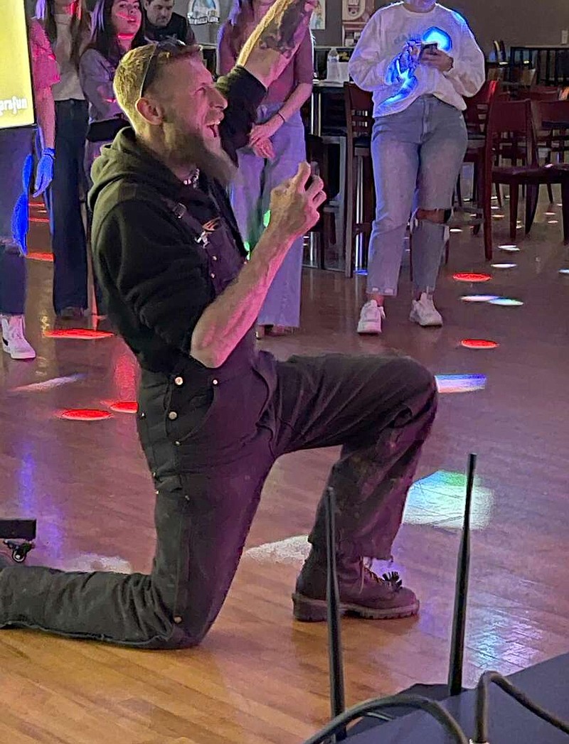 Josh Owens, one of the stars of the Discovery show "Moonshiners," cheers for a singer during a karakoke night at Betty's Big Country Dance Hall earlier this year. The venue, which hosted some filming for the 13th season of the show, will host a viewing party Tuesday at 6 p.m. (Submitted photo)