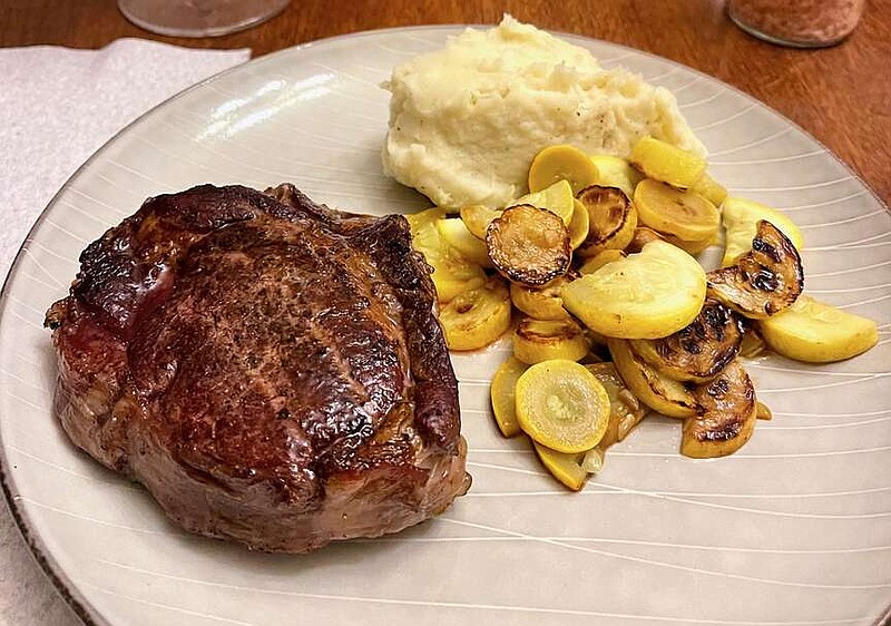Reverse Sear Steak With Garlic Butter served alongside sauteed squash and mashed potatoes (Arkansas Democrat-Gazette/Kelly Brant)