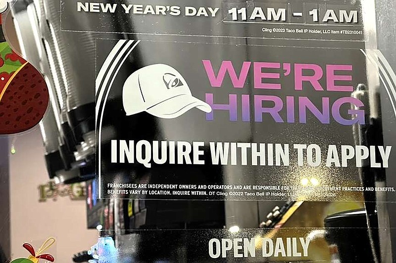 A hiring sign is displayed at a restaurant in Glenview, Ill., Tuesday, Dec.12, 2023. On Thursday, the Labor Department reports on the number of people who applied for unemployment benefits last week. (AP Photo/Nam Y. Huh)
