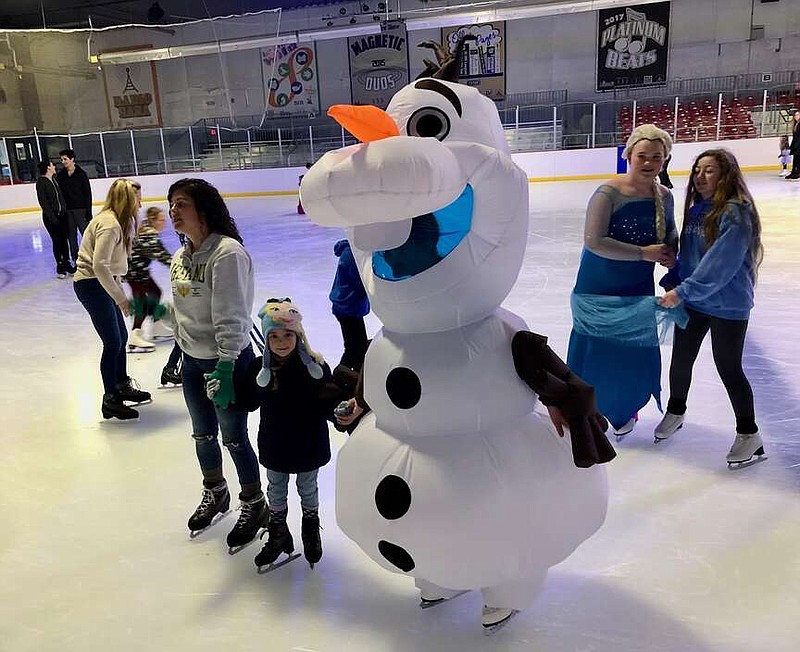 Joe Gamm/News Tribune photo: 
Olaf stops to pose with 6-year-old Skye Ludy and her mother, Lindsay Ludy, during the inaugural Ice Princess Skate at Washington Park Ice Arena Saturday afternoon, Dec. 23, 2023. As they pause to be photographed, Princess Elsa arrives to join the shot.