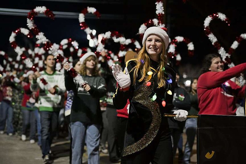 Bentonville High School band members perform, Saturday, December 9, 2023 during the annual Bentonville Christmas Parade at the downtown square in Bentonville. This yearâ€™s theme is â€˜Merry and Brightâ€™. The parade featured more than 100 floats and attractions, with more than 1,000 people participating, according to the Downtown Bentonville Incorporated website. Visit nwaonline.com/photos for today's photo gallery.

(NWA Democrat-Gazette/Charlie Kaijo)