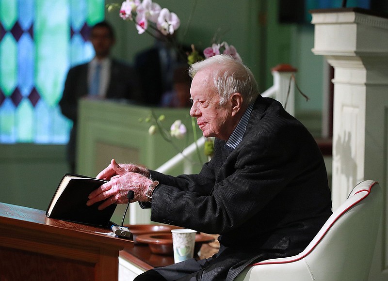 Former president Jimmy Carter, 94, opens his Bible to begin the lesson as he returns to Maranatha Baptist Church to teach Sunday School less than a month after falling and breaking his hip on June 9, 2019, in Plains, Georgia. (Curtis Compton/The Atlanta Journal-Constitution/TNS)