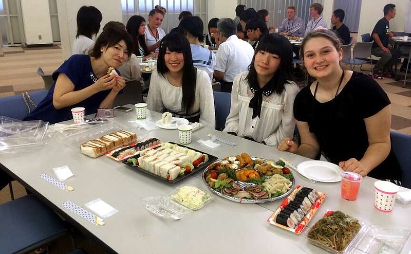 Elizabeth Powell, right, enjoys a meal with her host family while in Hanamaki, Japan, as part of the 2014 Sister City student delegation. (Submitted photo courtesy of the Hot Springs Sister City Program)