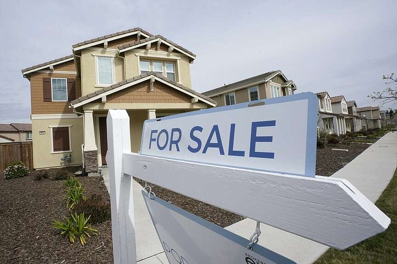 FILE - A "for sale" sign is posted in front of a home in Sacramento, Calif., March 3, 2022. The profit margin on median-priced single-family homes and condos nationally soared to 59% in the July-September 2023 quarter, according to a report released Thursday, Oct. 19, 2023, by real estate information provider Attom. (AP Photo/Rich Pedroncelli, File)