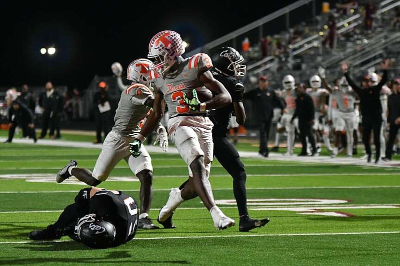 Texas High's Tradarian Ball looks back at a defender as he runs into the endzone against Whitehouse on Friday, Oct. 27, 2023, in Whitehouse, Texas. (Photo by Kevin Sutton/TXKSports.com)