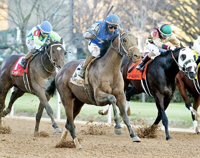 Catching Freedom, center, ridden by Cristian Torres, runs in Monday's Smarty Jones race at Oaklawn, along with Informed Patriot, left, ridden by Ricardo Santana Jr., and Just Steel, right, ridden by Ramon Vazquez. (Submitted photo courtesy of Coady Photography)