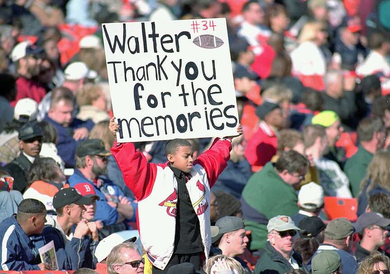 A young fan holds up a sign during Walter Payton's Memorial Service at Soldier Field in Chicago, on Nov. 6, 1999. (Jonathan Daniel/Allsport/Getty Images/TNS)