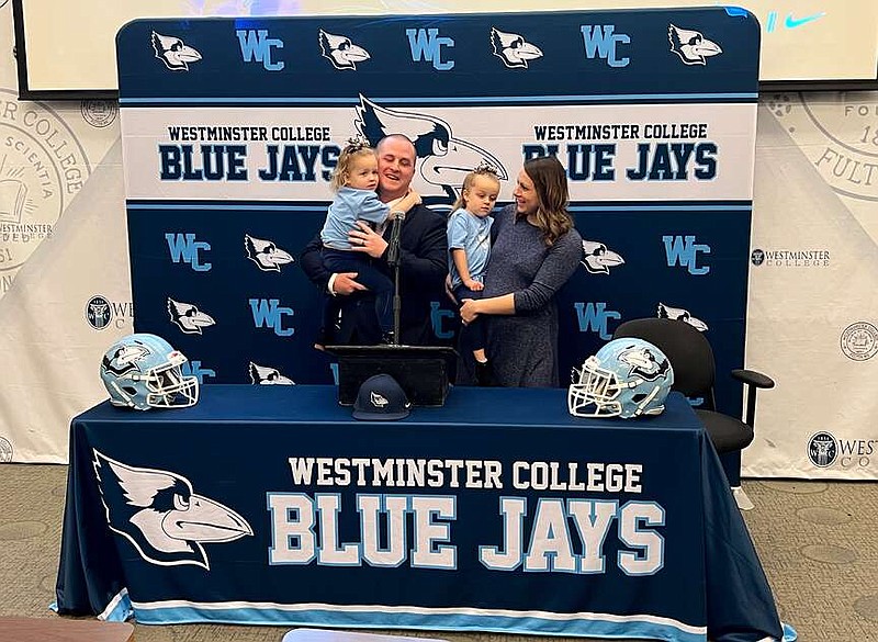 Photo courtesy Westminster College
Luke Butts stands with wife, Danielle, and two daughters, Sydney and Lainey, during Wednesday's press conference. Butts will serve as Westminster's new football head coach following the departure of John Welty.