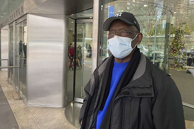 Taikwan Wright waits outside while his nephew is treated for asthma in the ICU in Bellevue Hospital in New York on Wednesday, Jan. 3, 2023. The previous week, New York City resumed a mask mandate for the city's 11 public hospitals. (AP Photo/Mary Conlon)