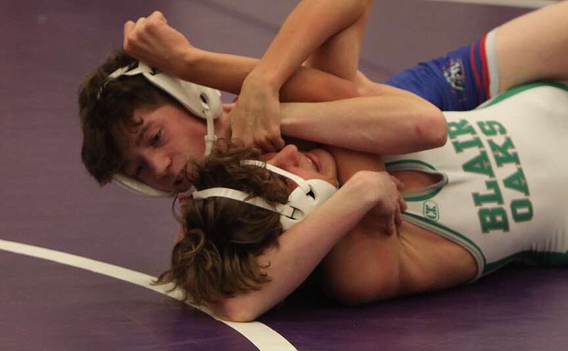 (Democrat photo/Evan Holmes)
Conner Farmer wins by fall over Jax Luebbering of Blair Oaks at the Tri-County Conference Tournament in Hallsville.