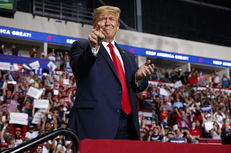 FILE - In this Sept. 16, 2019, file photo, Republican President Donald Trump arrives to speak at a campaign rally at the Santa Ana Star Center in Rio Rancho, N.M. New Mexico's top prosecutor said Friday, Jan. 5, 2024 that the state's five Republican electors cannot be prosecuted under the current law for filing election certificates that falsely declared Donald Trump the winner of the 2020 presidential race. (AP Photo/Evan Vucci, File)
