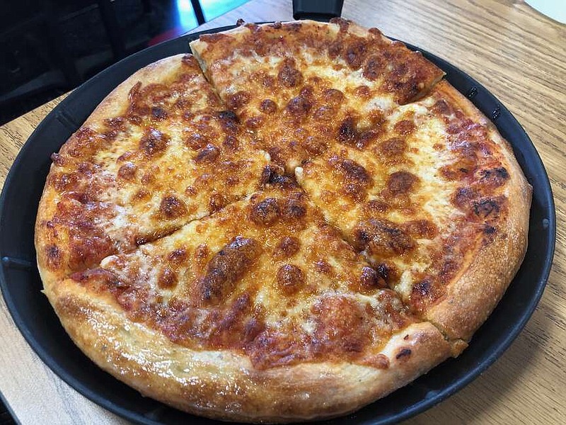 A cheese personal-pan pizza at Certified Pies. The pizzeria used to be part of a communal kitchen and now has its own space. (Arkansas Democrat-Gazette/Helaine R. Williams)
