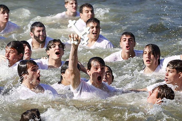 Annual dive for cross marks Epiphany | The Arkansas Democrat-Gazette - Vimarsana News