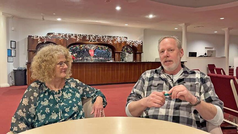 Vapors Live Manager Darrell Faircloth discusses Party Gras, a fundraiser for the Hot Springs Jazz Society, which will be held at the facility on Jan. 26 as Jazz Society President Valerie Tobin looks on.  (The Sentinel-Record/James Leigh)