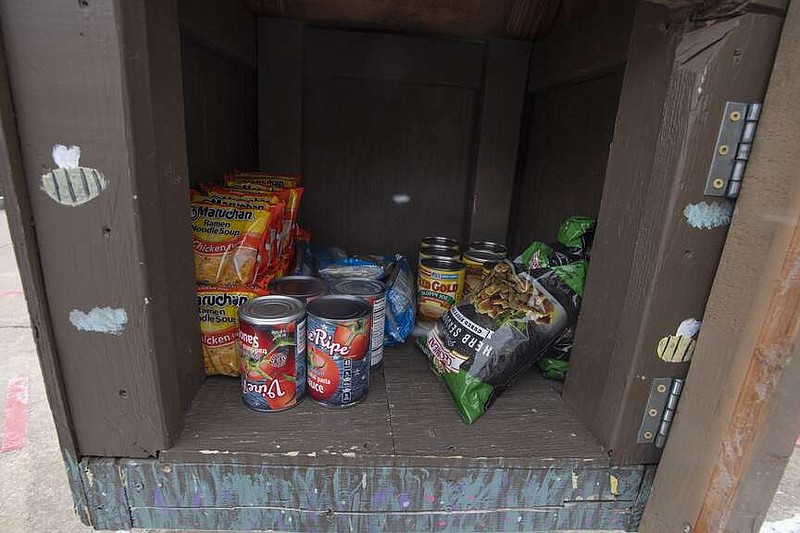 A Little Free Pantry is stocked with a variety of groceries Friday Jan. 12, 2024 on Willow Ave. in Fayetteville. Visit nwaonline.com/photo for today's photo gallery. (NWA Democrat-Gazette/J.T. Wampler)