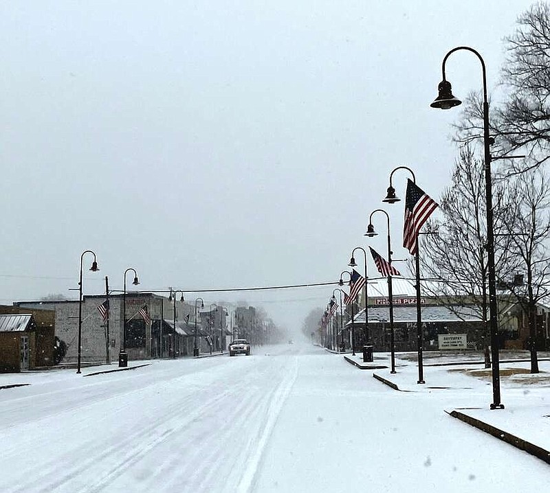 Randy Moll/Westside Eagle Observer
Snow fell and covered Main Street in Gentry Sunday afternoon as temperatures hovered in the single digits. Several inches fell in the area Sunday as a storm front and arctic blast moved through the area.