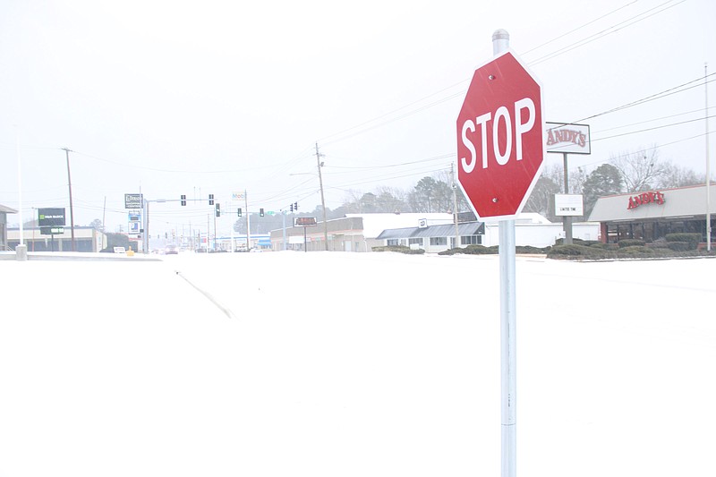N. West Ave. was a snowy scene early Monday morning. (Matt Hutcheson/News-Times)