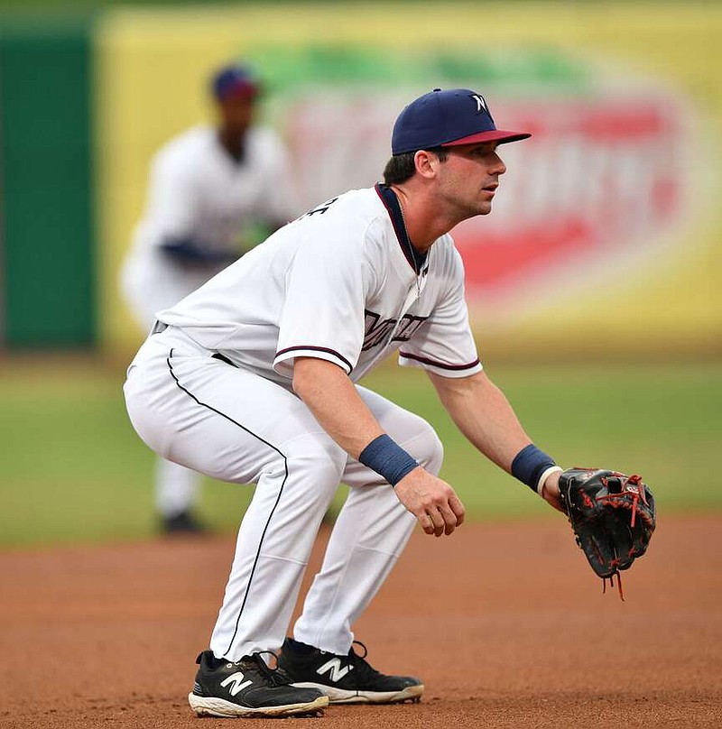 Northwest Arkansas Naturals third baseman Cayden Wallace takes his position near the bag Wednesday, Aug. 9, 2023, during play at Arvest Ballpark in Springdale. Wallace, a former Arkansas Razorback and 49th pick of the 2022 Draft by the Royals, could start this coming season back in Double-A. 
(NWA Democrat-Gazette/Andy Shupe)