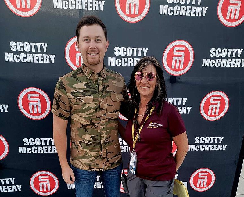 Submitted photo: 
Lori Smith-Schollmeyer, general manager of MU Health Care Capital Region Amphitheater, poses with entertainer Scotty McCreery during his May 2023 visit to Jefferson City.