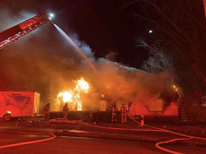 Firefighters battle a blaze on Thursday, Jan. 18, 2024, at 204 S.W. F St. in Bentonville.
(COURTESY OF THE CITY OF BENTONVILLE)