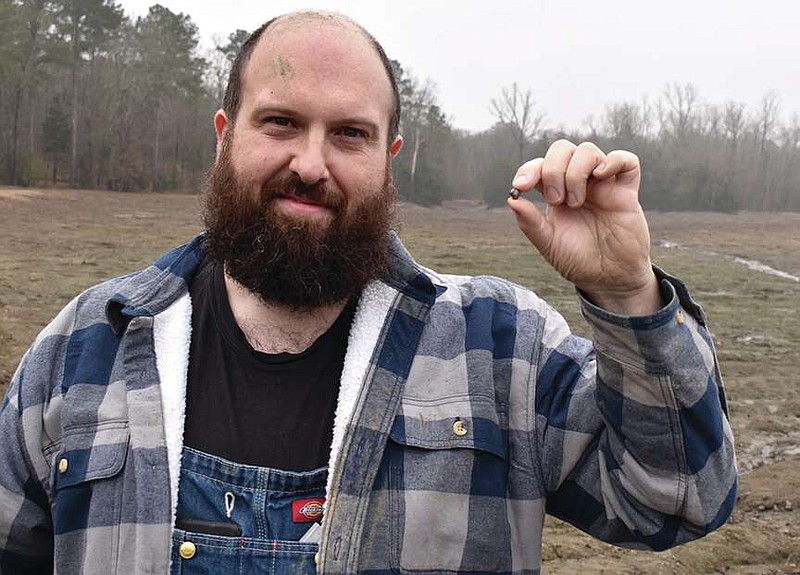 Julien Navas, of Paris, France, found a 7.46-carat diamond on the surface of Crater of Diamonds State Park in Murfreesboro on his first visit to the park's 37.5-acre search area. (Photo courtesy of Arkansas State Parks)