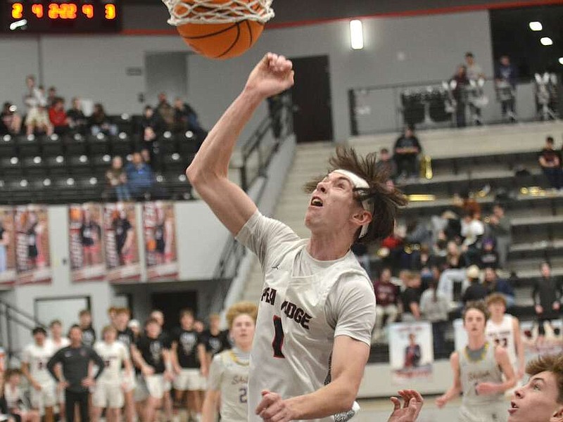 Annette Beard/Pea Ridge TIMES
Blackhawk senior Ben Wheeler, No. 1, scored 2 of his 21 points Friday night in the game against the Shiloh Saints. The Hawks defeated the Saints 66-51. See more on page 1B.