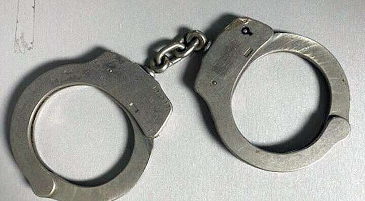 A pair of handcuffs are shown in this undated photo. (Los Angeles Police Department via AP)