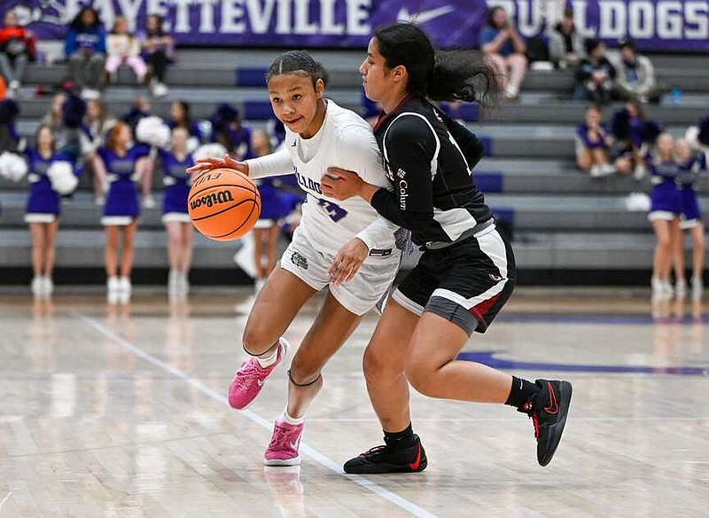 Fayetteville's Syniah Coachman (23) drives the ball in the first quarter on Wednesday, Jan. 3, 2024 at Bulldog Arena in Fayetteville. (NWA Democrat-Gazette/Caleb Grieger)