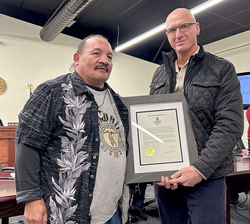 Lynn Kutter/Enterprise-Leader
Prairie Grove Mayor David Faulk (right) presented Dan Rivera with a plaque recognizing him as a Home Town Hero at the city council's Jan. 22 meeting. Faulk thanked Rivera for his willingness and dedication to help the community in many different ways.