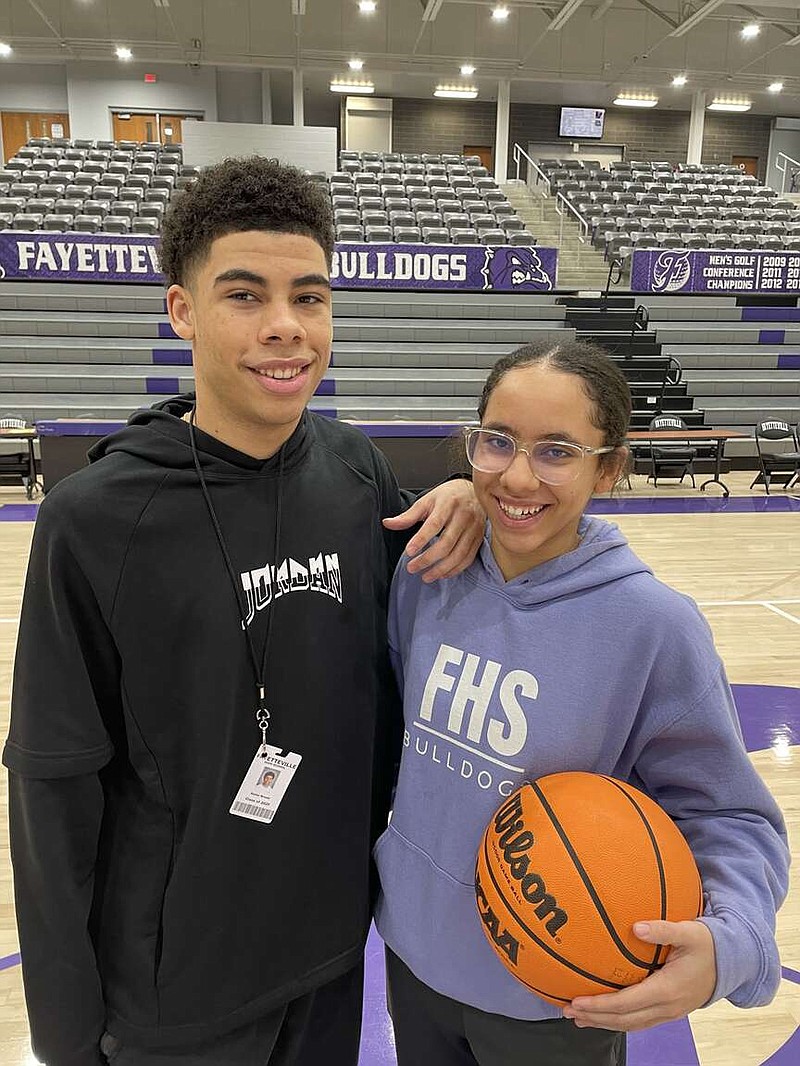 Xavier Brown and Whitney Brown are starting point guards for the Fayetteville boys and girls basketball teams. The two are also fraternal twins who were born about a minute apart in Fayetteville.
(NWA Democrat-Gazette/Rick Fires)