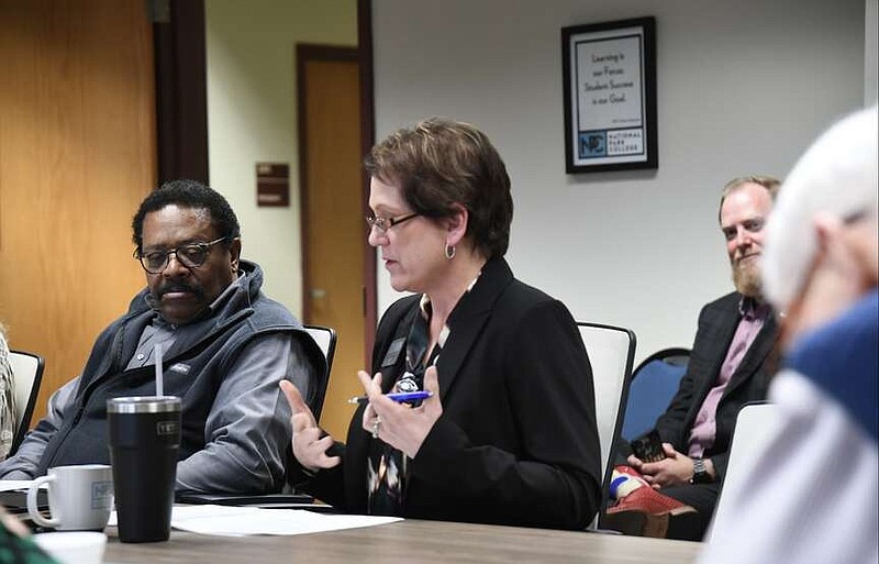 National Park College Vice President for Administration Kelli Embry, center, comments during her building and campus development report Wednesday at the Gerald Fisher Campus Center. (The Sentinel-Record/Lance Brownfield)