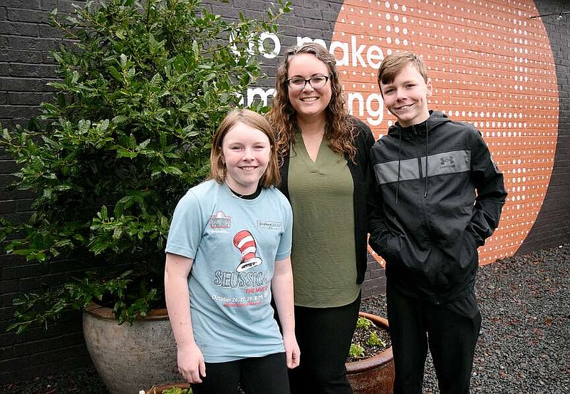 Nichole Holze poses for a photo with her children — Lucy, left and Luke — at Local Habit on WEdnesday, Jan. 24, 2024, in Nash, Texas. Holze recently started ArkLaTex Adventure Club to help area residents find fun that's not too far from home. (Staff photo by Stevon Gamble)