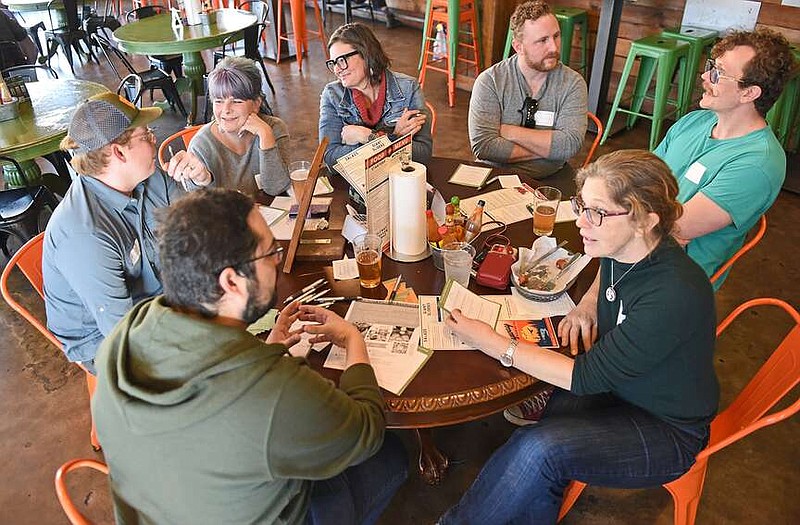 Members of the local farming community converse during a pre-season gathering Sunday at Flyway Brewing in North Little Rock.
(Arkansas Democrat-Gazette/Staci Vandagriff)