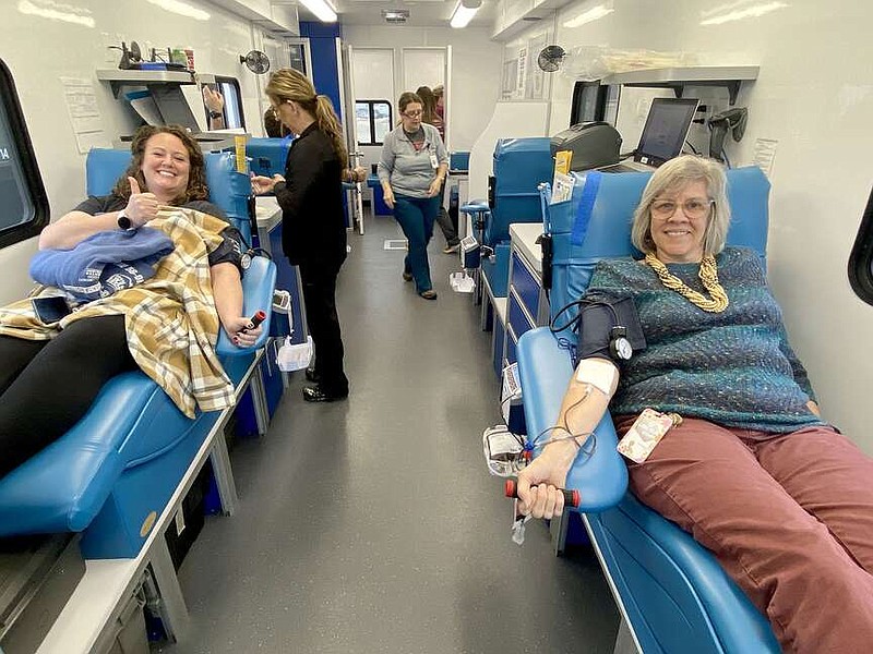 Submitted photo
Lincoln High teachers Laurie Smith (left) and Dona Gregory donate blood in the blood mobile for Community Blood Center of the Ozarks on Jan. 24. The mobile was parked behind the high school for the drive sponsored by tLincoln High's Medical & Emergency Pathway Students program.