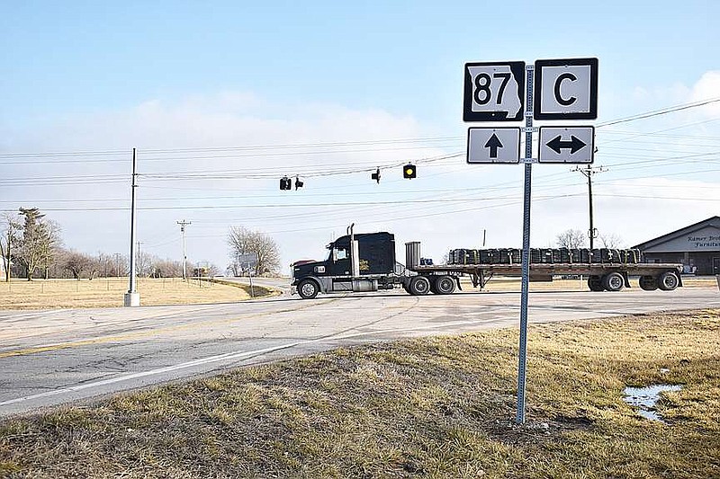 Democrat photo/Garrett Fuller — A semitruck continues traveling eastbound Sunday (Jan. 28, 2024,) on Route C at the intersection of Missouri 87 and Route C near High Point. The Missouri Department of Transportation is seeking feedback on plans to install a roundabout at the intersection during an open-house meeting planned for 4:30-6 p.m. Thursday in the High Point R-III School cafeteria, 60909 Route C. Anyone is welcome to attend the meeting, which will have exhibits showing the planned work. MoDOT staff will also be present to answer questions, and listen to comments and concerns.
