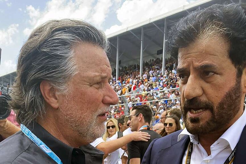 FILE - Michael Andretti, left, talks with FIA President Mohammed bin Sulayem before the Formula One Miami Grand Prix auto race at Miami International Autodrome, Sunday, May 8, 2022, in Miami Gardens, Fla. Formula One has rejected Andretti Global's application to join the global racing series in 2025 or 2026 but said Wednesday, Jan. 31, 2024, it is willing to revisit the issue in 2028 when General Motors has an engine ready for competition. (AP Photo/Jenna Fryer, File)