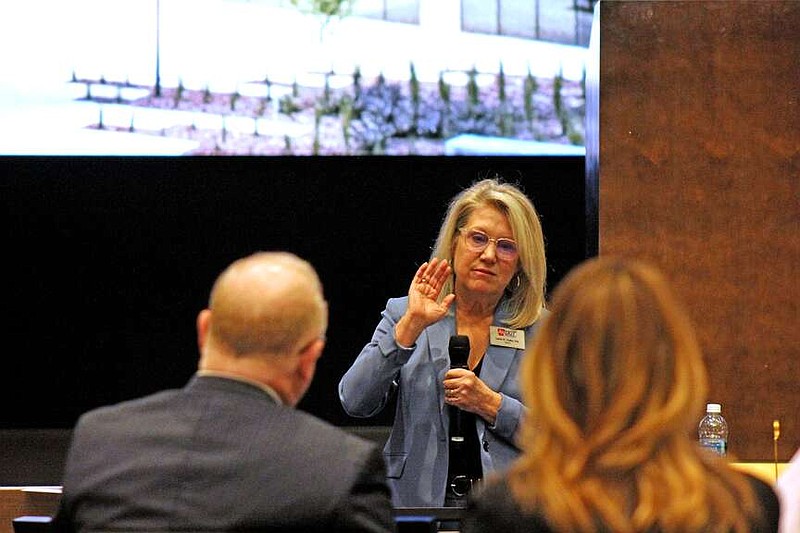 Arkansas Department of Transportation Director Lorie Tudor discusses the status of the widening project on Interstate 30 with elected and business leaders at Oaklawn Event Center Thursday morning. (The Sentinel-Record/James Leigh)