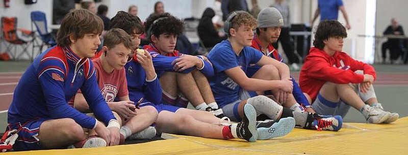Democrat photo/Evan Holmes
The Pintos watch the action of the MMA Varsity Colonel Classic mat-side.
