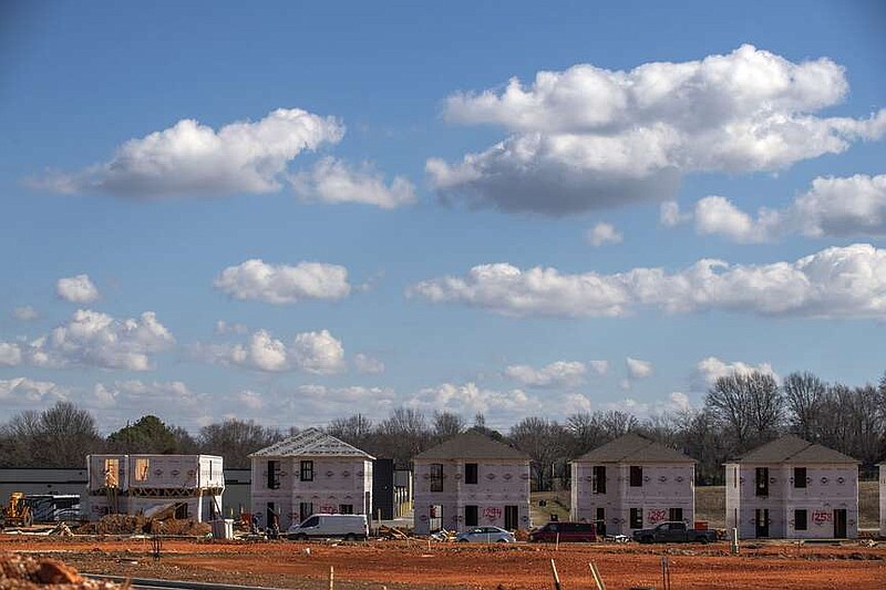 Construction continues Friday Feb. 3, 2024 at the Cobblestone Farm Community near Wedington Dr. in Fayetteville. The community aims to provide affordable housing to low-income families.  Visit nwaonline.com/photo for today's photo gallery. (NWA Democrat-Gazette/J.T. Wampler)