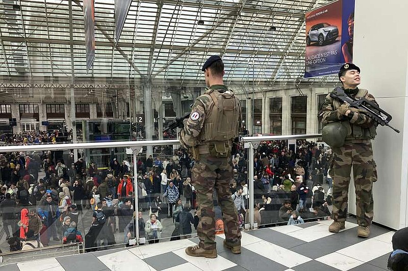 Soldiers patrol inside the Gare de Lyon station after an attack, Saturday, Feb. 3, 2024 in Paris. A man injured three people Saturday in a stabbing attack at the major Gare de Lyon train station in Paris, another nerve-rattling security incident in the Olympic host city before the Summer Games open in six months. (AP Photo/Christophe Ena)