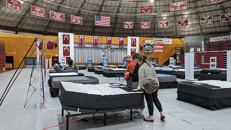 Ryan Pivoney/News Tribune photo: 
The Morfeld family looks at a mattress on display Sunday, Feb. 4, 2024, in the Linn High School gymnasium. The school's band and choir programs partnered with Custom Fundraising Solutions to host the mattress sale as a fundraiser.
