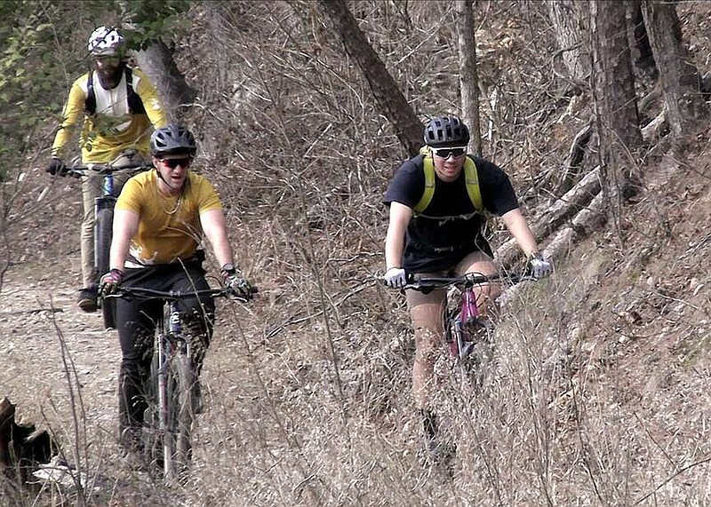 Riders make their way along one of the trails in the Northwoods Trails System, which will be hosting the third leg of the Southern Enduro Mountain Bike Tour in March. (The Sentinel-Record/Donald Cross)