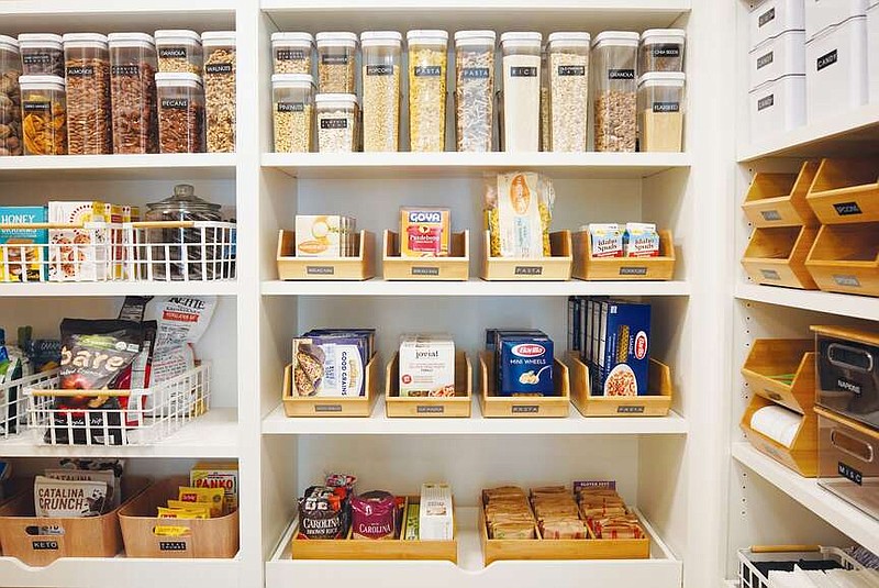 Labels, bins and baskets impose order on this home's pantry, making cooking and putting food away faster and more efficient. But before a pantry can look this good, home chefs need to clean out old, unwanted and expired food. (Courtesy of mDesign)