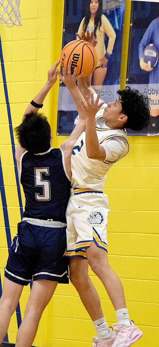 Submitted photo
Bulldog Devin Thor (2) goes high to block a Barnstormer shooter during the Decatur-Thaden variety boys basketball contest in Decatur on Jan. 30. The Barnstormers prevailed, taking the conference win, 65-28, over the Bulldogs.