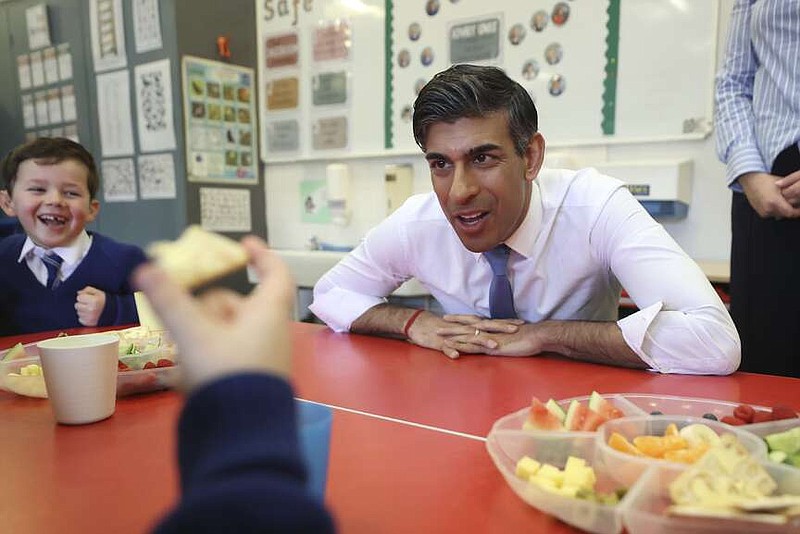 British Prime Minister Rishi Sunak speaks with students as he visits Glencraig Integrated Primary School in Holywood, during his trip to Northern Ireland following the restoration of the powersharing executive, Monday Feb. 5, 2024. (Liam McBurney/PA via AP)