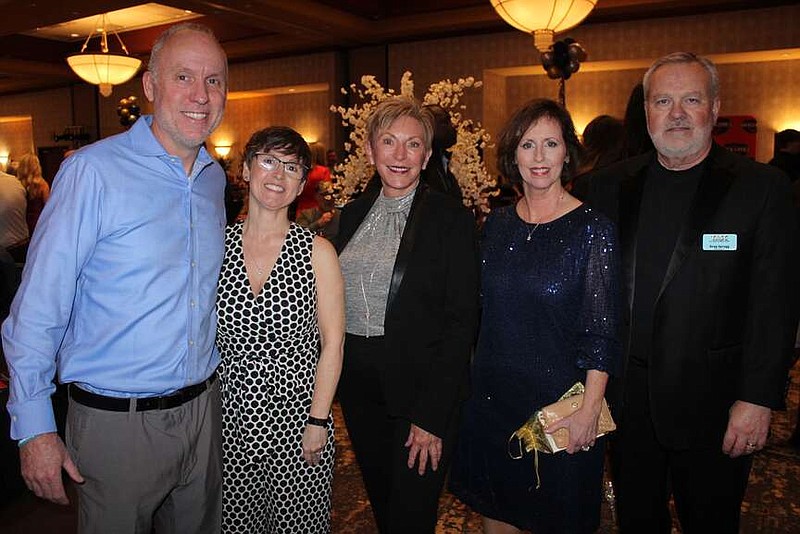 Matt and Rebecca Kendall (from left), Celia Swanson and Dawn and Greg Spragg, Teen Action & Support Center (TASC) co-founders, visit at the All In Casino Night benefit on Feb. 3 at the Embassy Suites in Rogers. 
(NWA Democrat-Gazette/Carin Schoppmeyer)