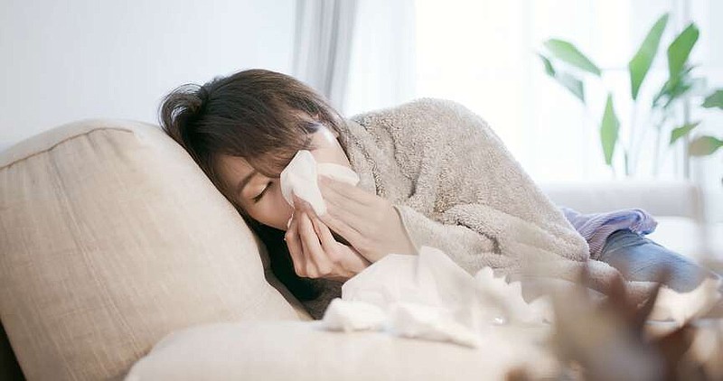 A person with flu-like symptoms is shown in this undated file photo (Dreamstime/TNS)