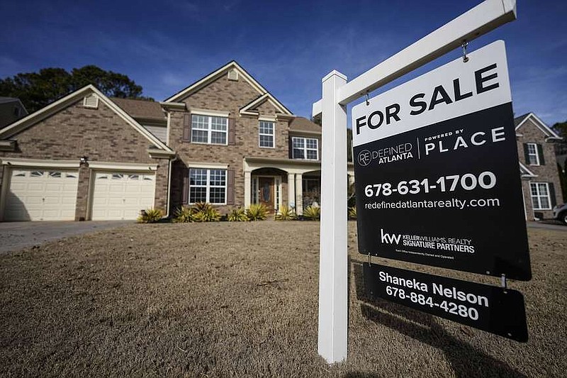 A sign announcing a home for sale is posted outside a home, Thursday, Feb. 1, 2024, in Aceworth, Ga., near Atlanta. On Thursday, Freddie Mac reports on this week's average U.S. mortgage rates. (AP Photo/Mike Stewart)