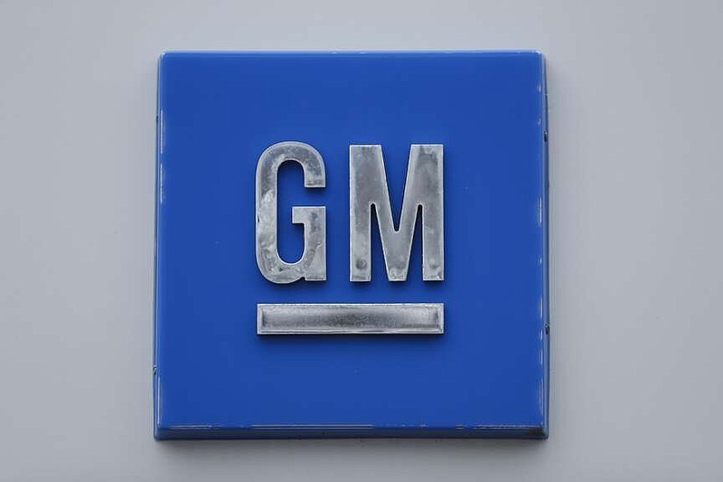 FILE - A GM logo is shown at the General Motors Detroit-Hamtramck Assembly plant in Hamtramck, Mich., Jan. 27, 2020. General Motors has hired a former Tesla executive, Kurt Kelty, to serve in the newly created role of vice president of Batteries as the automaker continues to work on its electric vehicle strategy. Kelty will be charged with GM's battery cell strategy and a new end-to-end approach. (AP Photo/Paul Sancya, file)